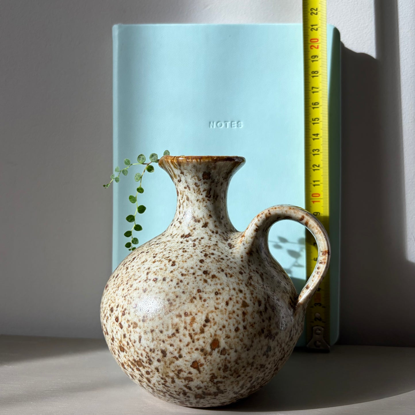 String of Turtles in a handmade speckled stoneware jug