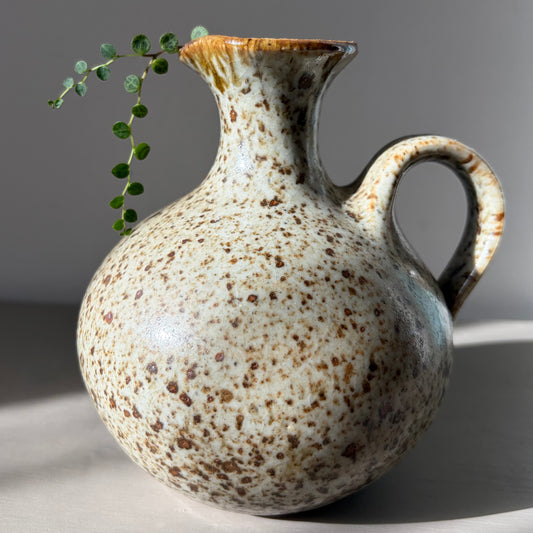 String of Turtles in a handmade speckled stoneware jug